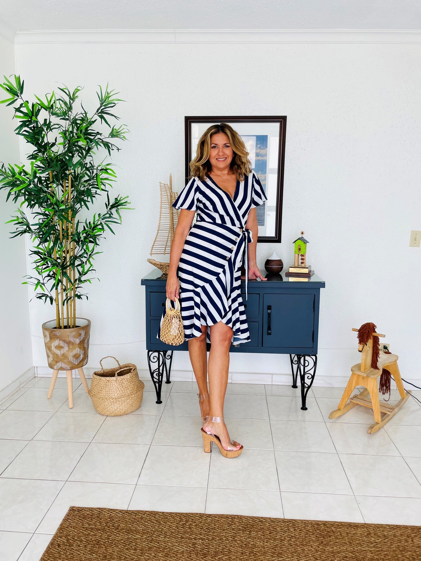 Striped wrap around sunny dress. For that casual and tropical look, you need.