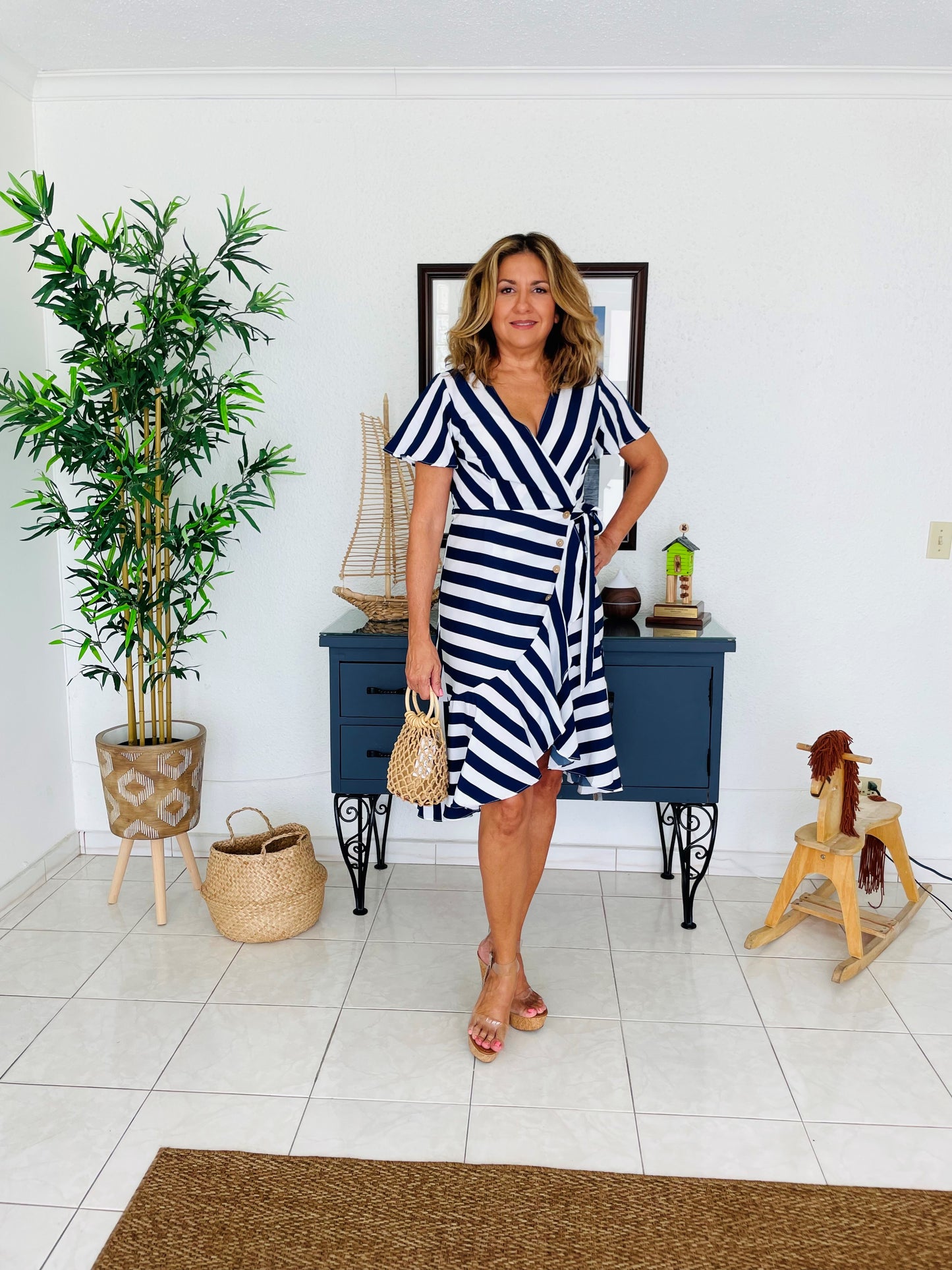 Striped wrap around sunny dress. For that casual and tropical look, you need.