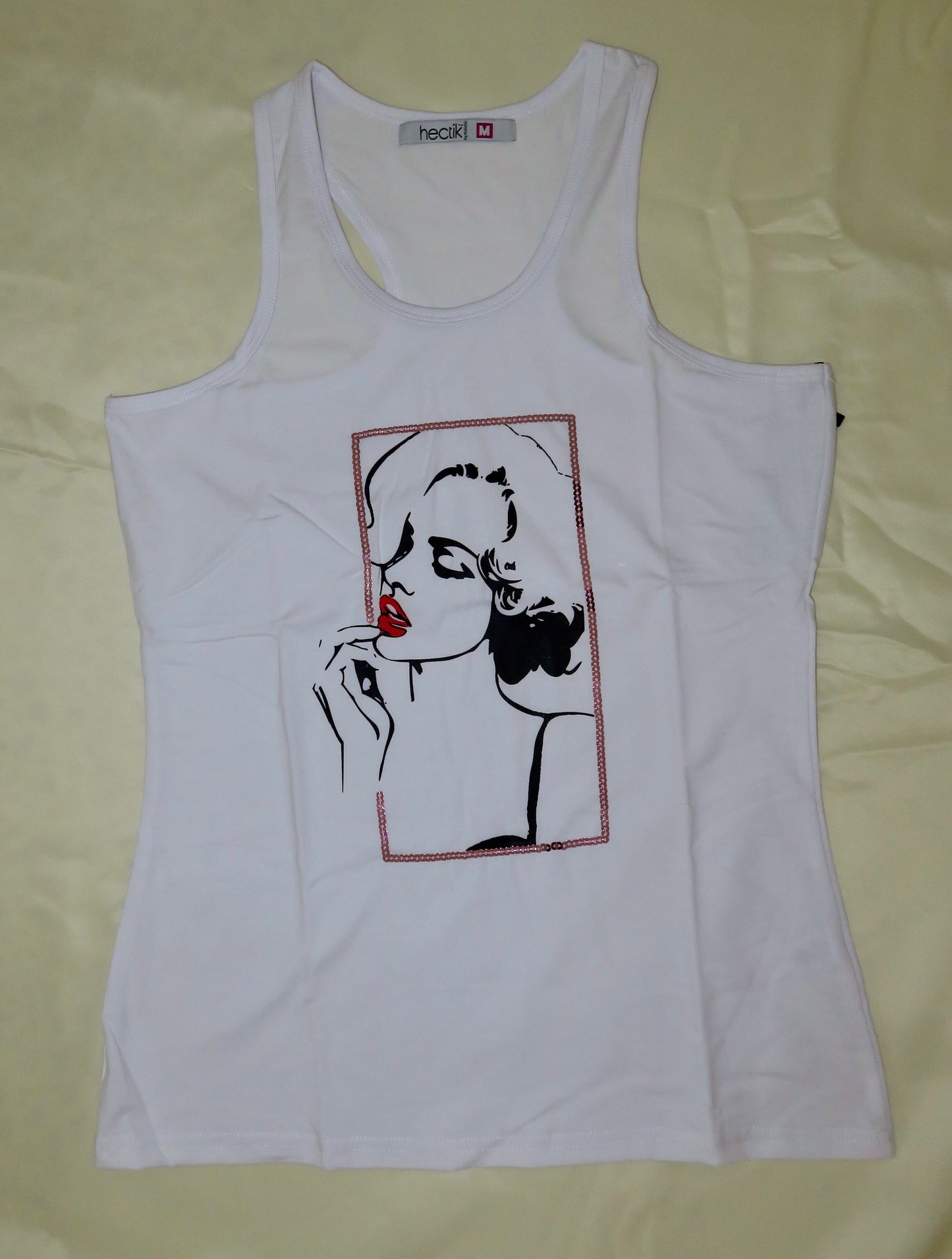 Sequins art tank top for a casual and fun look.
