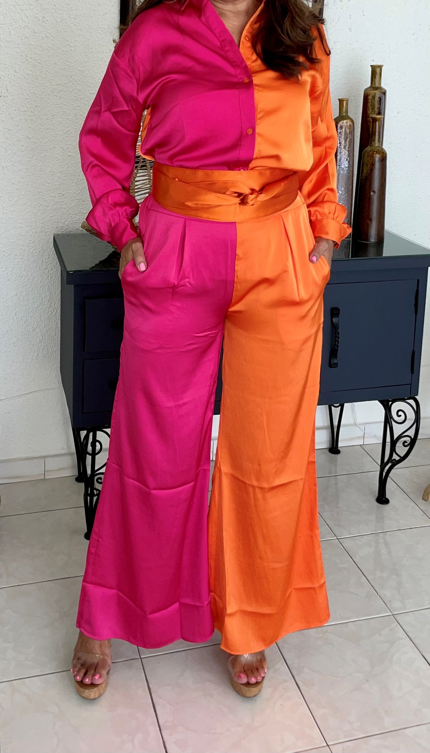 Pink and orange button down satin shirt. Look for trousers.