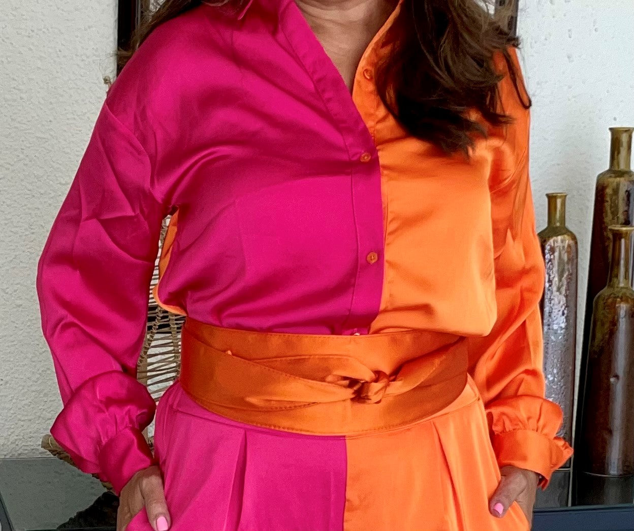 Pink and orange button down satin shirt. Look for trousers.