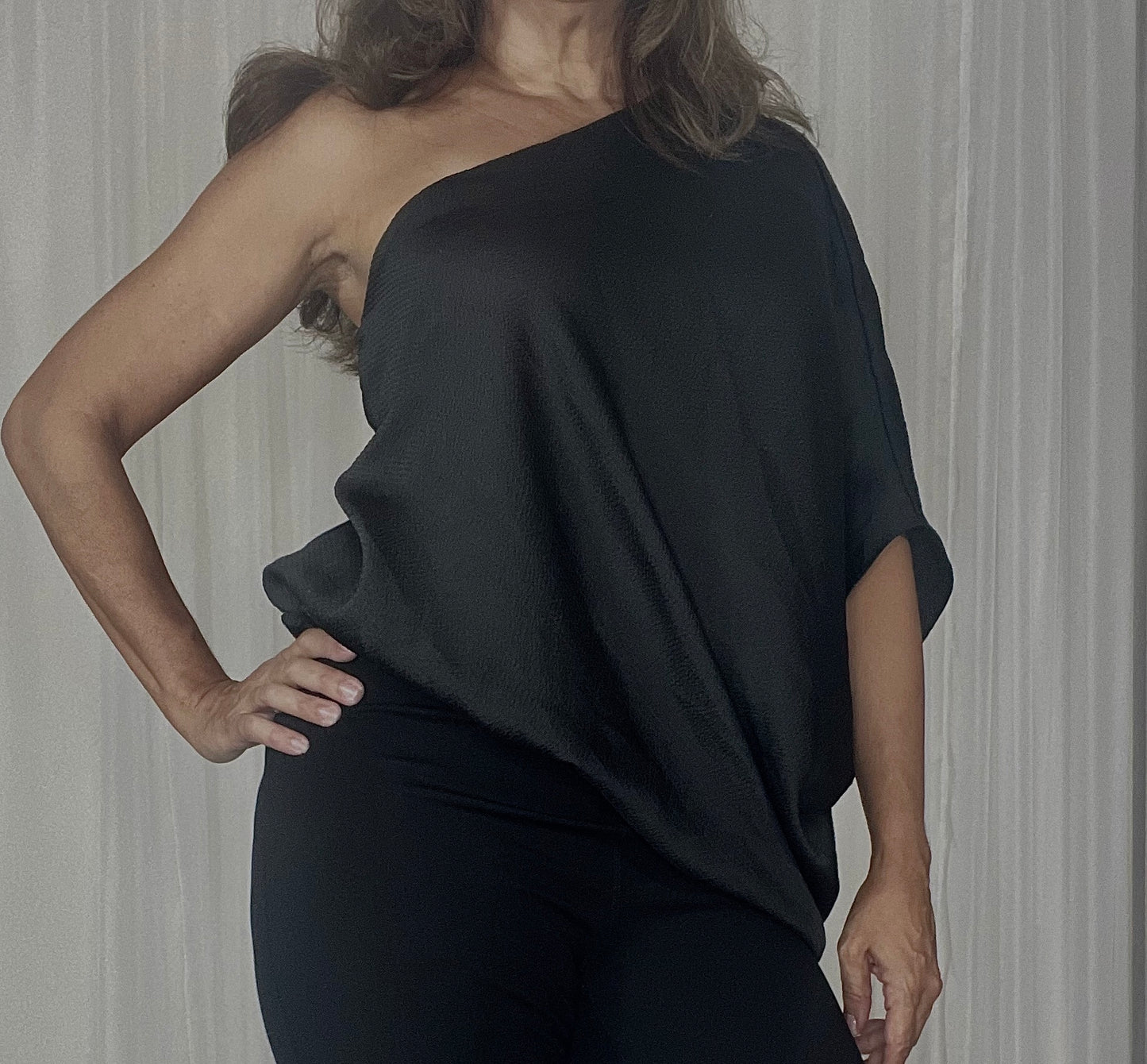 One shoulder loose fit blouse elegant and sexy at the same time.