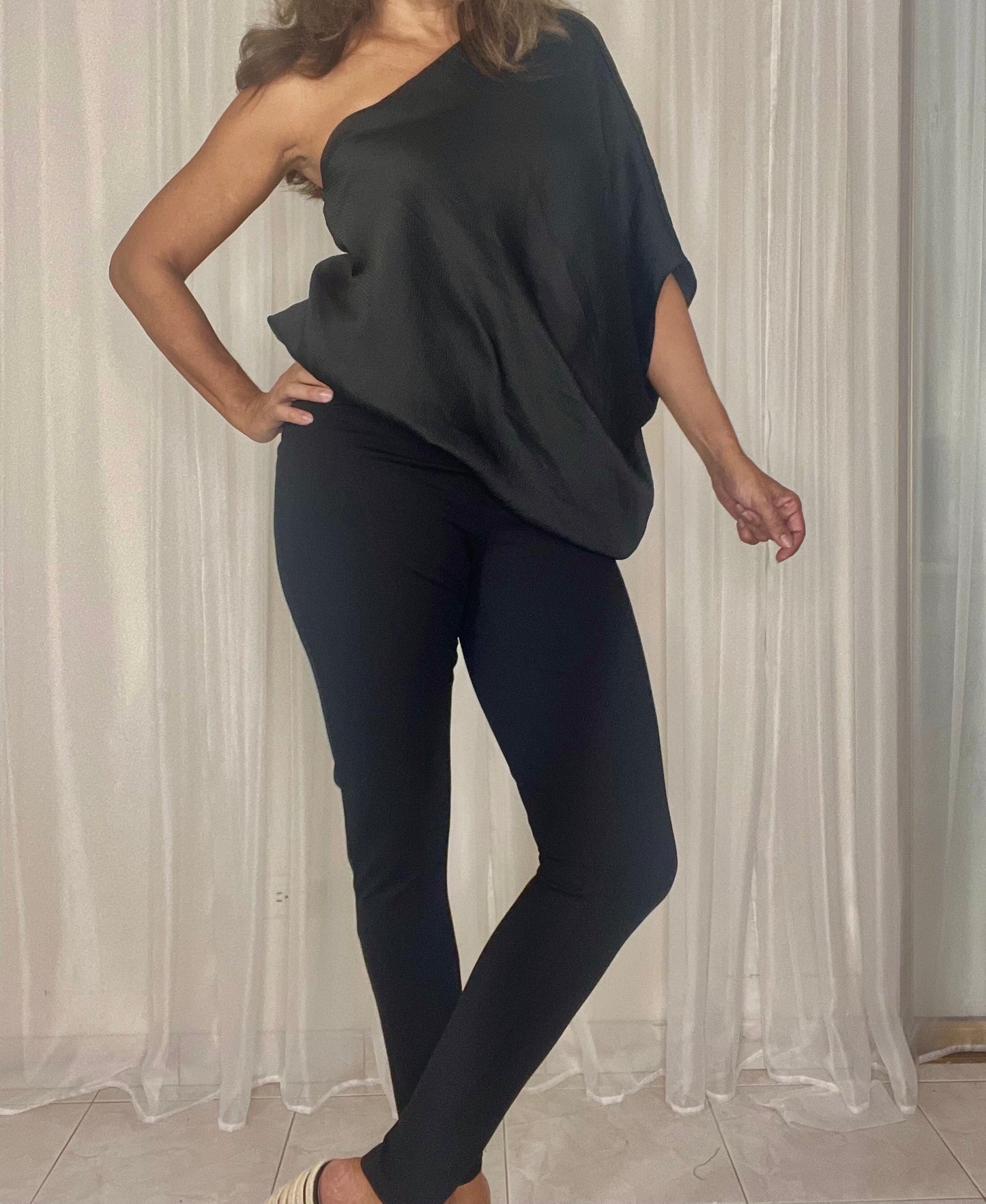 One shoulder loose fit blouse elegant and sexy at the same time.