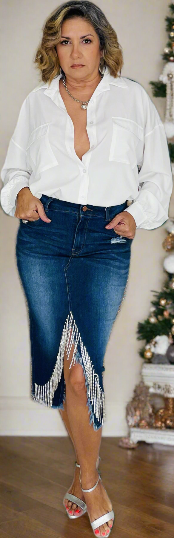 Pencil jean skirt with rhinestones tassels. Perfect fit with fun and festive detail.