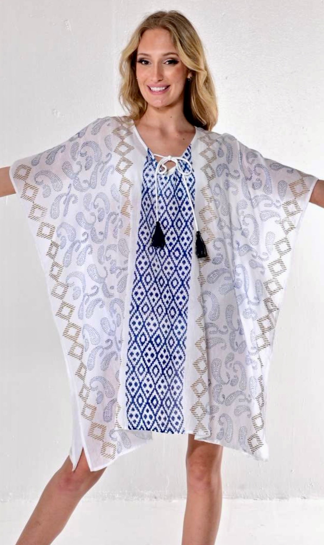 White, blue and gold tunic.